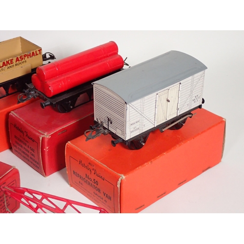 235 - Two boxed Hornby 0 gauge No.1 Timber Wagons, a boxed Gas Cylinder Wagon, a No.50 Refrigerator Van, a... 