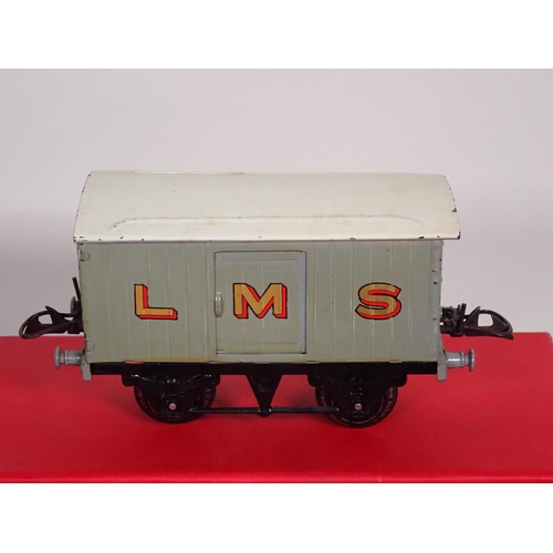 244 - An unboxed Hornby 0 gauge No.2 Lumber Wagon, No.1 L.M.S. Luggage Van in reproduction box, and ten un... 