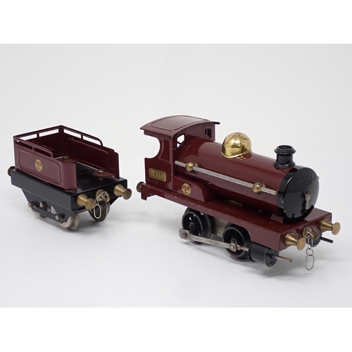 246 - An unboxed Hornby 0 gauge clockwork Series 0 No.1 0-4-0 Locomotive and Tender in maroon No.2710