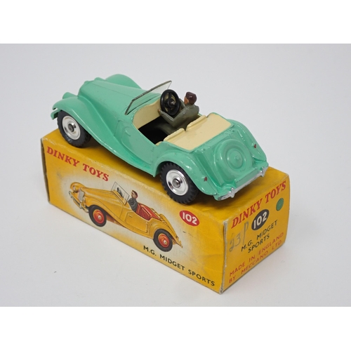 266 - A rare boxed Dinky Toys No.102 green MG Midget with spun hubs