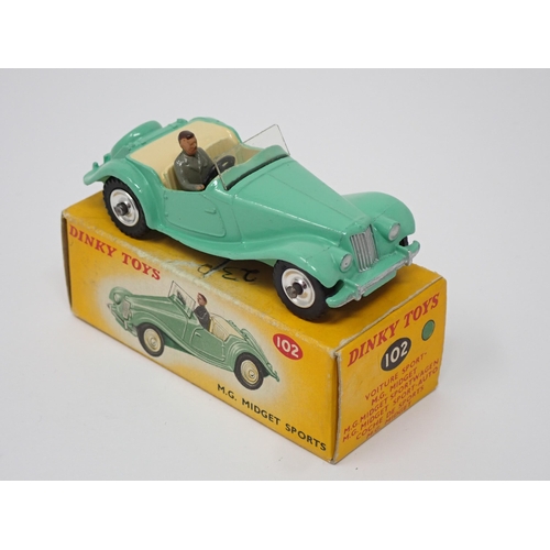 266 - A rare boxed Dinky Toys No.102 green MG Midget with spun hubs