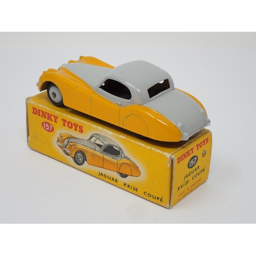 269 - A boxed Dinky Toys No. 157 yellow and grey Jaguar XK120