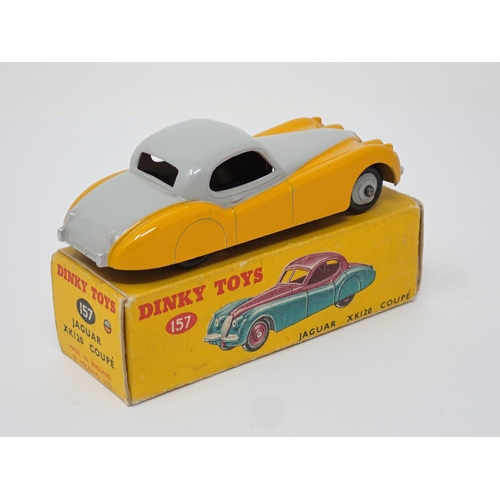 269 - A boxed Dinky Toys No. 157 yellow and grey Jaguar XK120