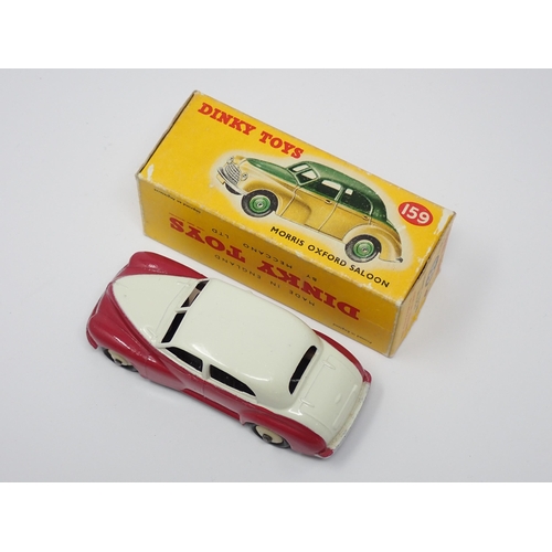 271 - A boxed Dinky Toys No.159 maroon and cream Morris Oxford