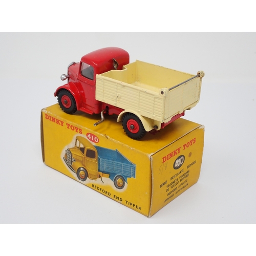 293 - A rare Dinky Toys No.410 green and red Bedford Tipper Lorry with plastic hubs