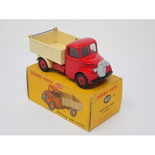 293 - A rare Dinky Toys No.410 green and red Bedford Tipper Lorry with plastic hubs