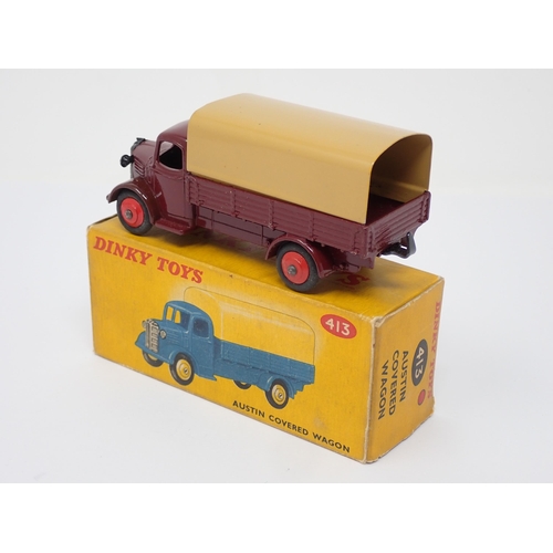 294 - A boxed Dinky Toys No.413 maroon and tan Austin Covered Wagon