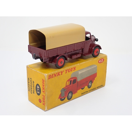 294 - A boxed Dinky Toys No.413 maroon and tan Austin Covered Wagon