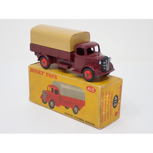 294 - A boxed Dinky Toys No.413 maroon and tan Austin Covered Wagon