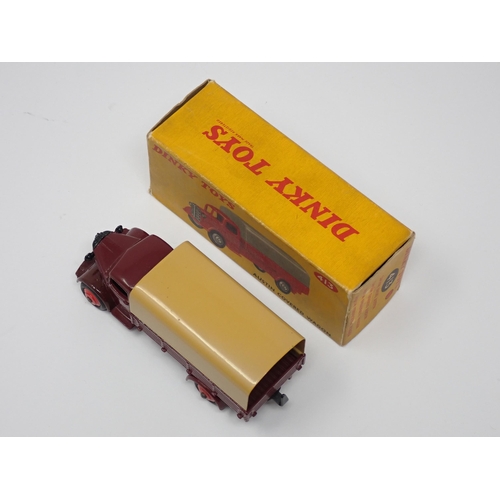 294 - A boxed Dinky Toys No.413 maroon and tan Austin Covered Wagon