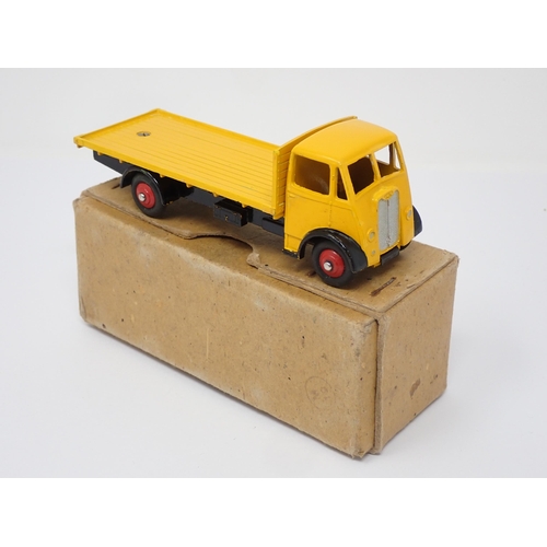 309 - A boxed Dinky Supertoys No.512 yellow Guy Flat Truck