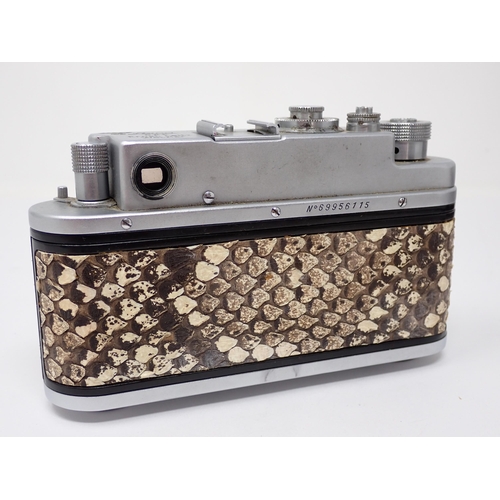 356 - A vintage Camera bearing Leica D.R.P. Ernst Leitz Wetzlar stamp and German Eagle emblem, in leather ... 