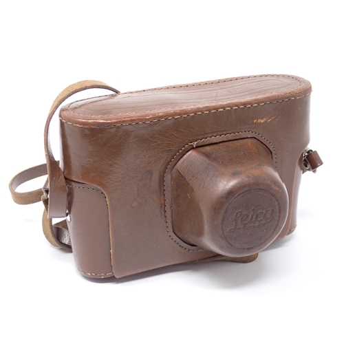 356 - A vintage Camera bearing Leica D.R.P. Ernst Leitz Wetzlar stamp and German Eagle emblem, in leather ... 