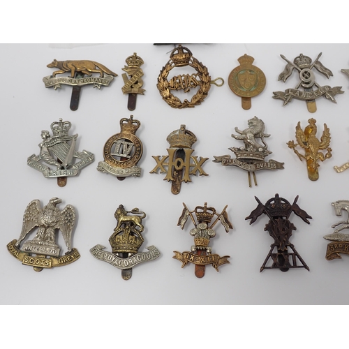 364 - Approximately 60 British Army Cap and Arm Badges (some possibly restrikes)