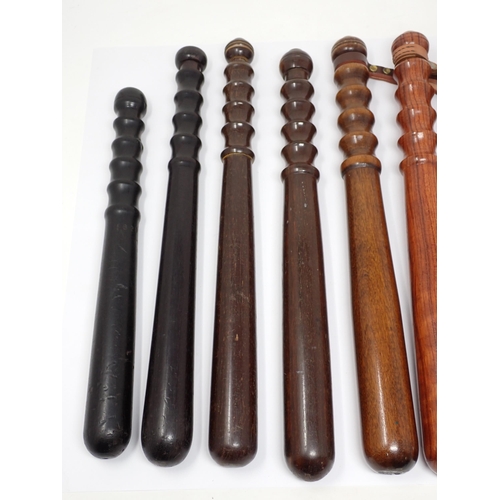 375 - Nine assorted wooden Police Truncheons