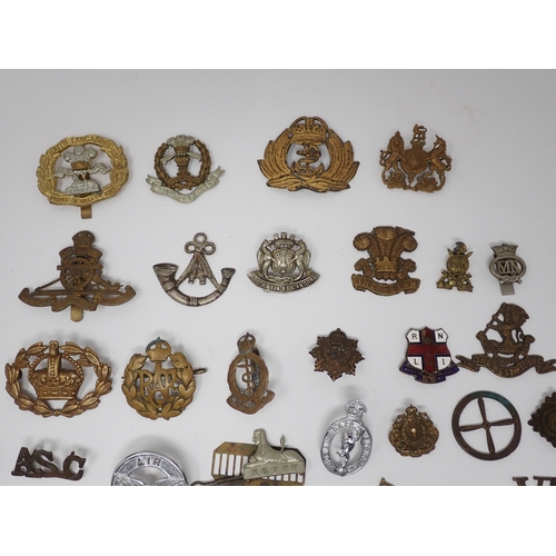 379 - A collection of British Army Cap and shoulder Badges