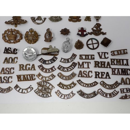 379 - A collection of British Army Cap and shoulder Badges