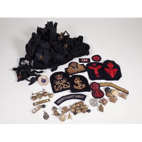 390 - A quantity of military Cap and Shoulder Badges and Buttons including The Border Regiment, East Yorks... 