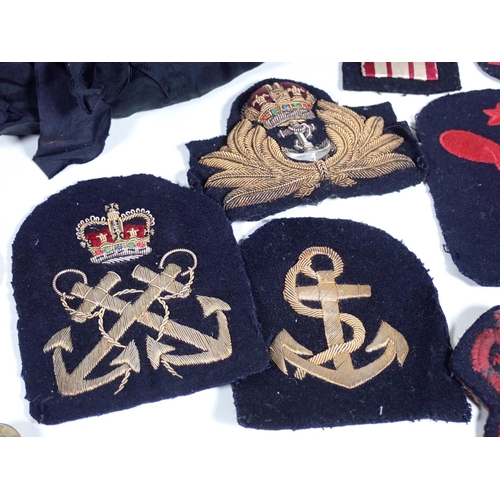 390 - A quantity of military Cap and Shoulder Badges and Buttons including The Border Regiment, East Yorks... 