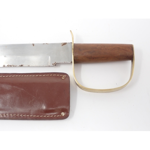 424 - A U.S. military Sheath knife, another Sheath Knife with D-shaped guard, a Fairburn-Sykes style Knife... 