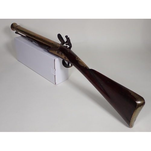 452 - An early flintlock brass barrelled Blunderbuss engraved 'London' on the 16in barrel, significant los... 