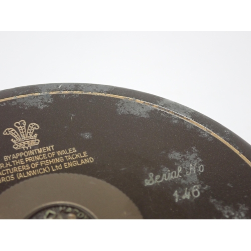 533 - A Hardy Bros. mahogany Presentation Case containing two 1st Edition Golden Prince Presentation Reels... 