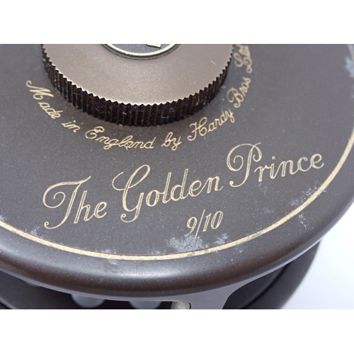 533 - A Hardy Bros. mahogany Presentation Case containing two 1st Edition Golden Prince Presentation Reels... 