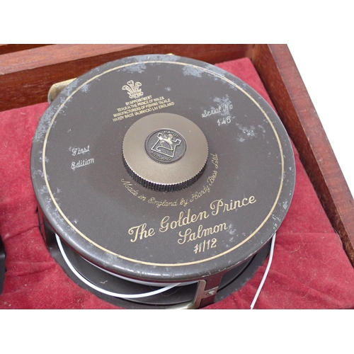 533 - A Hardy Bros. mahogany Presentation Case containing two 1st Edition Golden Prince Presentation Reels... 