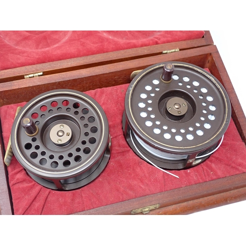 533 - A Hardy Bros. mahogany Presentation Case containing two 1st Edition Golden Prince Presentation Reels... 