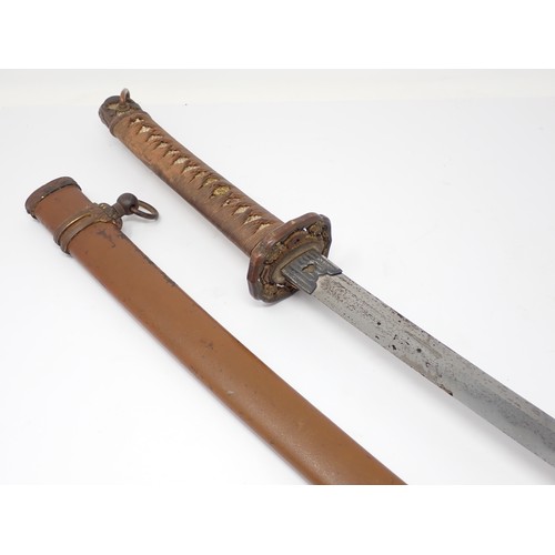 437 - A Japanese Katana with pierced tsuba and bound shagreen grip in metal scabbard, cutting edge 64 1/2c... 