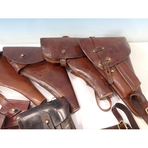 386 - A lot of leather Holsters and three leather Sword Frogs