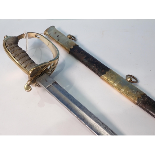 414 - A 19th Century Royal Navy Officer's Sword with shagreen grip within leather and brass scabbard