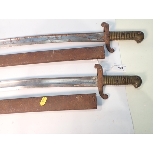 438 - Two 19th Century French Bayonets with brass grips and metal scabbards