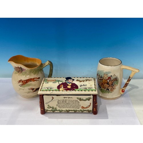 462A - A Crown Devon John Peel musical Cigarette Box, a Royal Doulton Hunting Jug and another musical Hunti... 