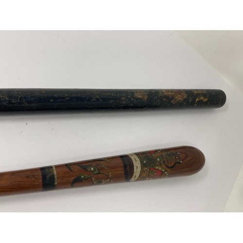 350 - A Victorian black painted Police Truncheon 2ft L and another painted Truncheon with ribbed grip 1ft ... 