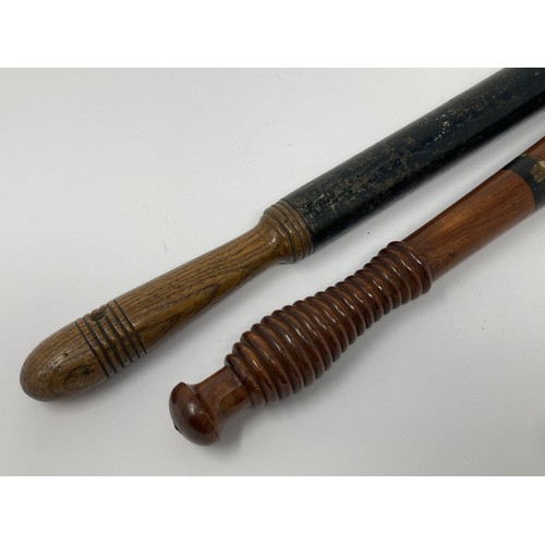 350 - A Victorian black painted Police Truncheon 2ft L and another painted Truncheon with ribbed grip 1ft ... 