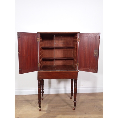 465 - A 19th Century mahogany and crossbanded Cabinet fitted pair of cupboard doors with inlaid bird decor... 