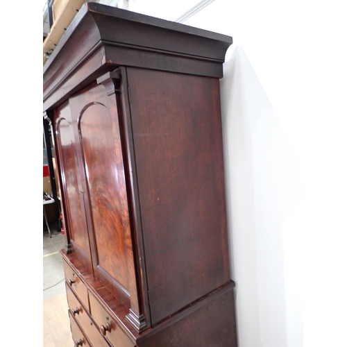 1 - A Victorian mahogany Linen Press the upper section fitted pair of arched doors above base of two sho... 