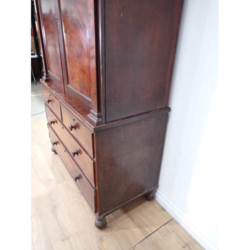 1 - A Victorian mahogany Linen Press the upper section fitted pair of arched doors above base of two sho... 