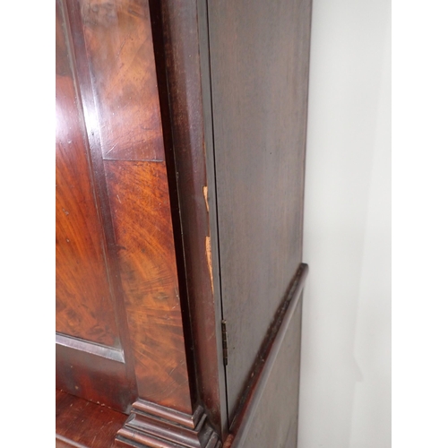 1 - A Victorian mahogany Linen Press the upper section fitted pair of arched doors above base of two sho... 