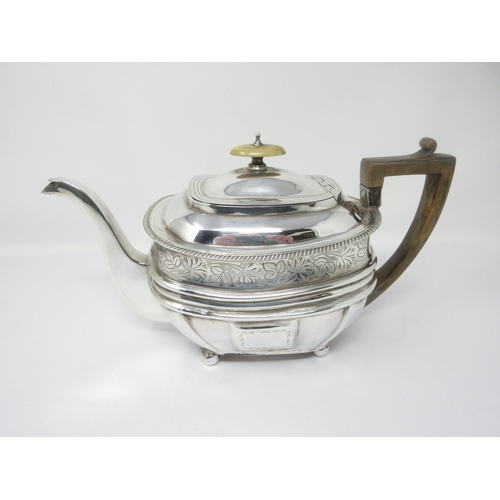 111 - A George III silver Teapot of boat shape with leafage engraved frieze and initials, on ball feet, Lo... 