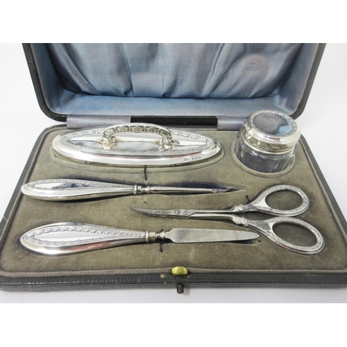 112 - A George V silver mounted five piece Manicure Set, Sheffield 1913-14, in case