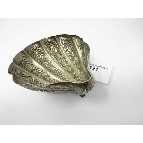 121 - An Eastern silver scallop shape Dish decorated palm trees, etc