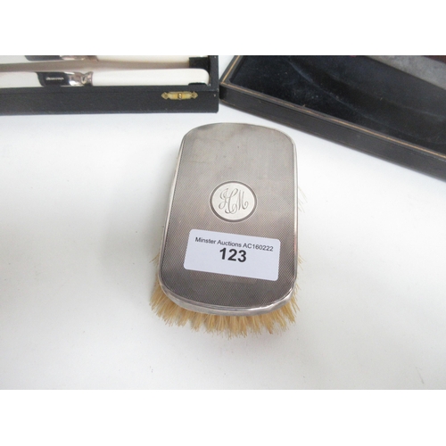 123 - A silver mounted Hair Brush, case of Fish Eaters and a Carving Knife and Steel, in case