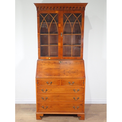 13 - A Georgian style yew wood veneered Bureau Bookcase 6ft 4in H x 2ft 10in W