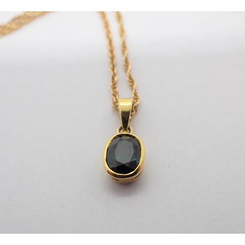 196 - An oval Pendant set blue stone on 14ct gold chain