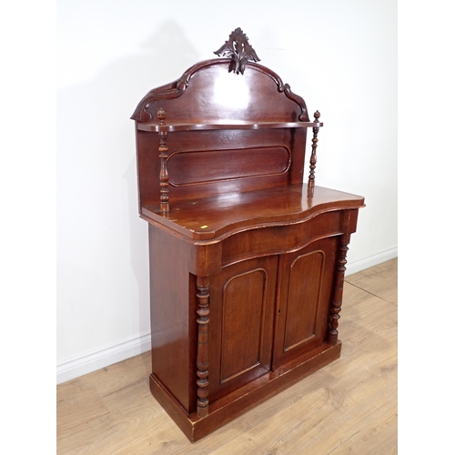 239 - A Victorian mahogany Chiffonier with raised gallery back above serpentine front over pair of cupboar... 