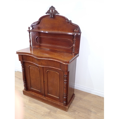 239 - A Victorian mahogany Chiffonier with raised gallery back above serpentine front over pair of cupboar... 