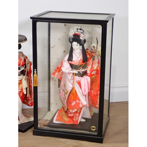 240 - A collection of Chinese Costume Dolls including two in display cases