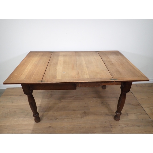 246 - An oak folding top Dining Table bearing label 'The Bee Table' and three slat back Kitchen Chairs